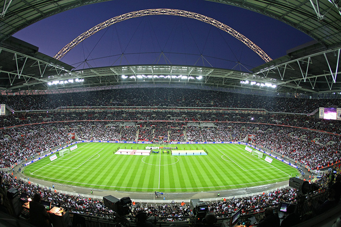 Image inside Wembley stadium, looking out across the pitch