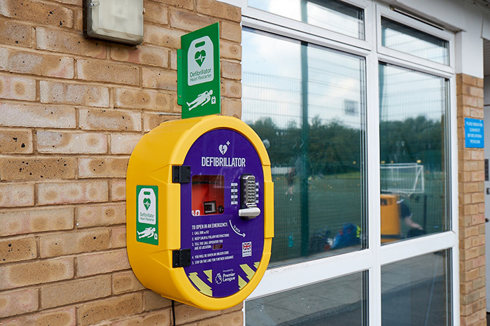 A Premier League Defibrillator installed on a wall at Southfields Academy