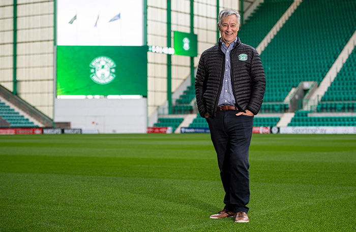 Hiberian FC chairman in front of the new big screens-