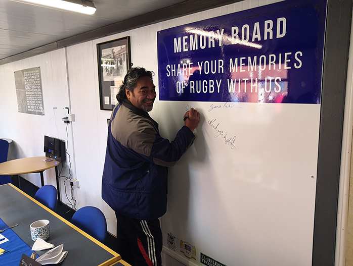Hitro Okesene signs the memory board in Workington Town RLFC new Legends Lounge.