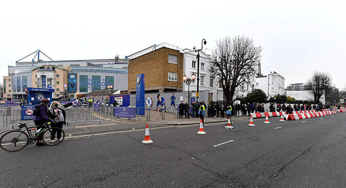 People queuing to be vaccinated at Chelsea FC's Stamford Bridge stadium