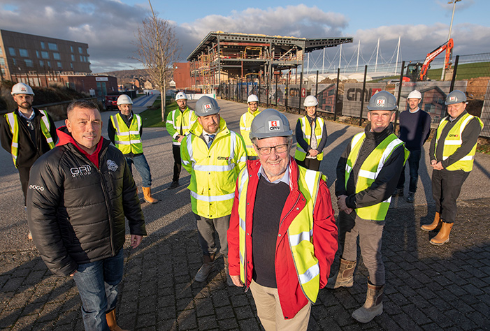 Richard Caborn, former Sports Minister and Sheffield Central MP (centre) joins key stakeholders celebrate the latest construction milestone at Sheffield Olympic Legacy Park Community Stadium.