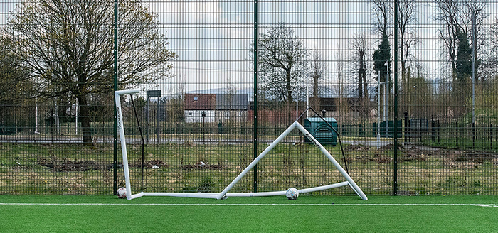 A goalpost knocked down following bad weather