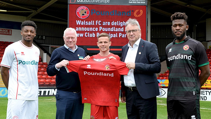 Poundland and Walsall Football Club players wearing sponsored football shirts