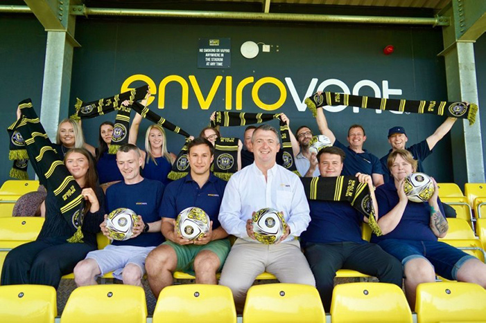Andy Makin, Managing Director at EnviroVent, with supporters at Harrogate Town AFC