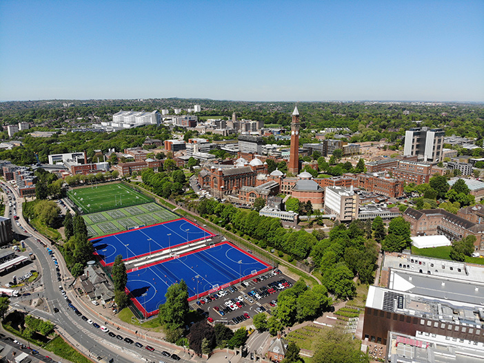University of Birmingham and sporting venue against skyline