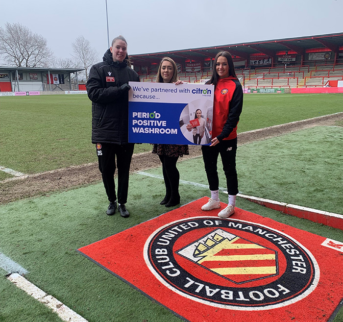 FC United of Manchester Physio Liv Smith (left), Lisa Byrne – Citron Hygiene (centre) and women’s team player Corie Mather (right) are proud to be tackling period poverty.