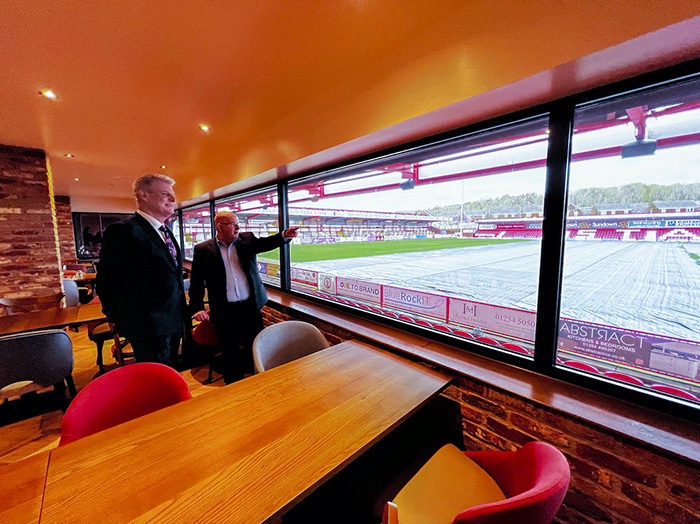 David Burgess MD of Accrington Stanley FC showing Sports Minister Stuart Andrew MP the facilities at the Wham Stadium