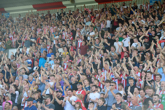Fans at a Lincoln City vs Fleetwood Town football match