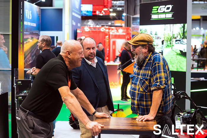 A SALTEX exhibitor talking to a visitor on his stand