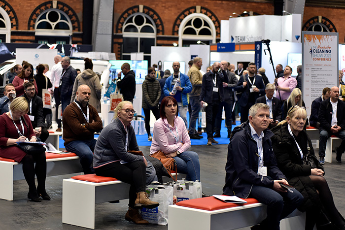 People listening to a captivating speech at the Manchester Cleaning Show
