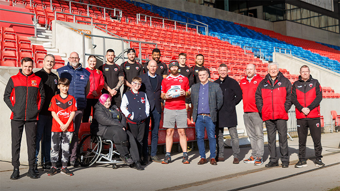 Mayor Dennett is joined by representatives of Salford Red Devils, Salford Red Devils Foundation, Salford Red Devils Women’s, PDRL, LDSL and local rugby league community clubs gather at the Salford Community Stadium