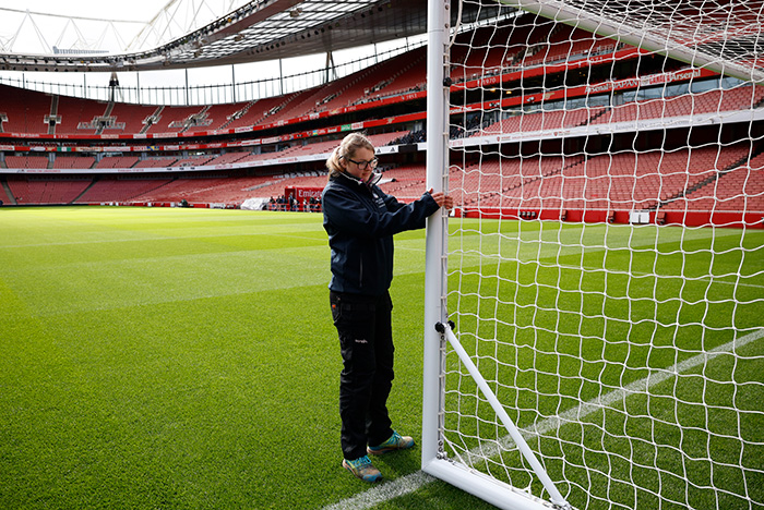 A female groundstaff adjusting the goals at the Emirates Stadium for Arsenal vs Tottenham in the Barclays Women’s Super League