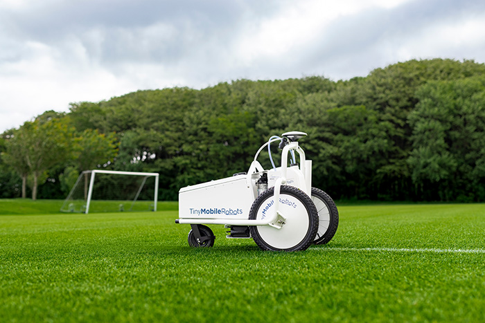 TinyLineMarker Robot from Origin Amenity Solutions on a football pitch
