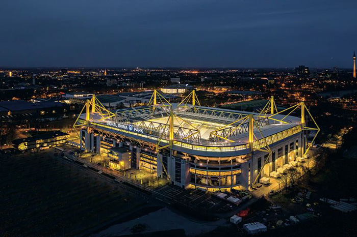 A well-illuminated stadium as seen at night