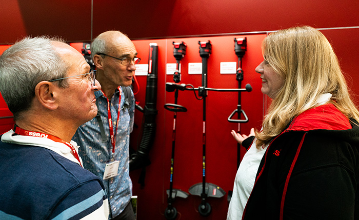 An exhibitor at SALTEX talking to visitors to her stand