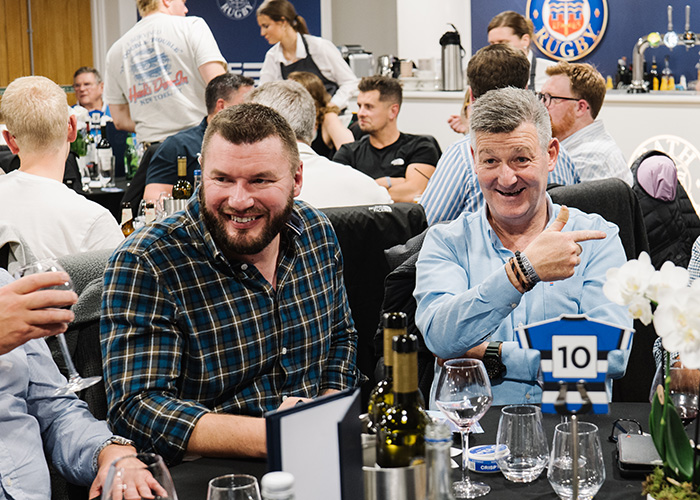 Fans at Bath Rugby's The 10s' Lounge drinking and having a post-game chat