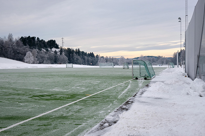 A snow covered football pitch