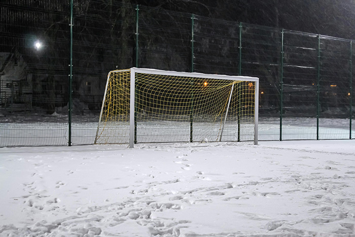 A football goal covered in snow