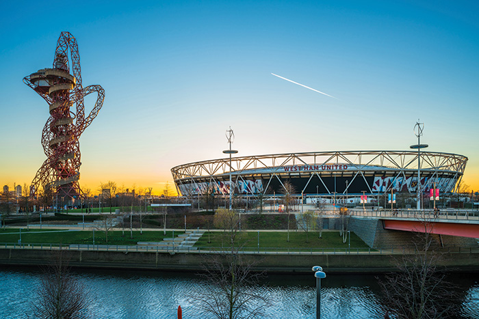 Westham United's London Stadium as seen from a distance at sunset