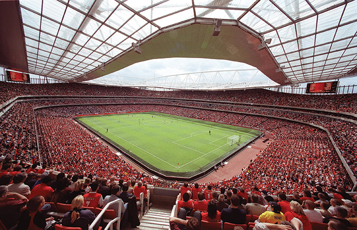 A football game at the Emirates, held underneath their clear roof