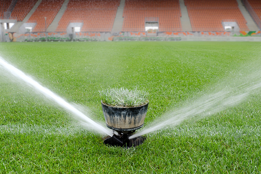 a sports turf irrigation system spraying water