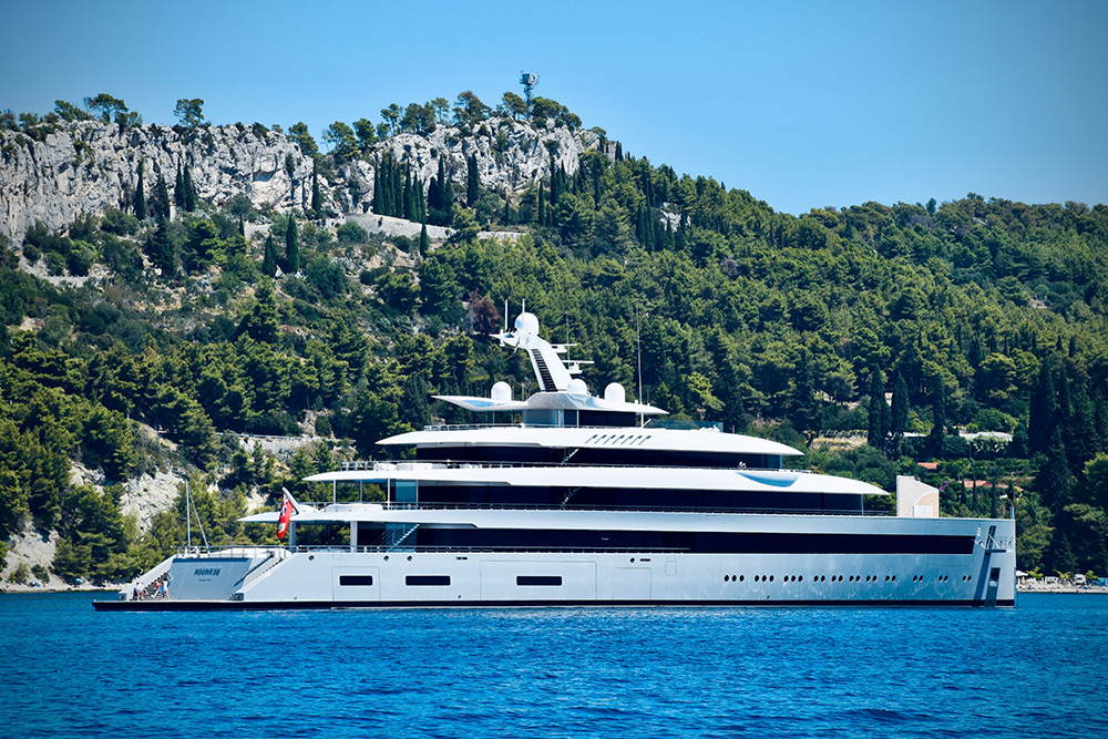 A super yacht floating of a tropical island